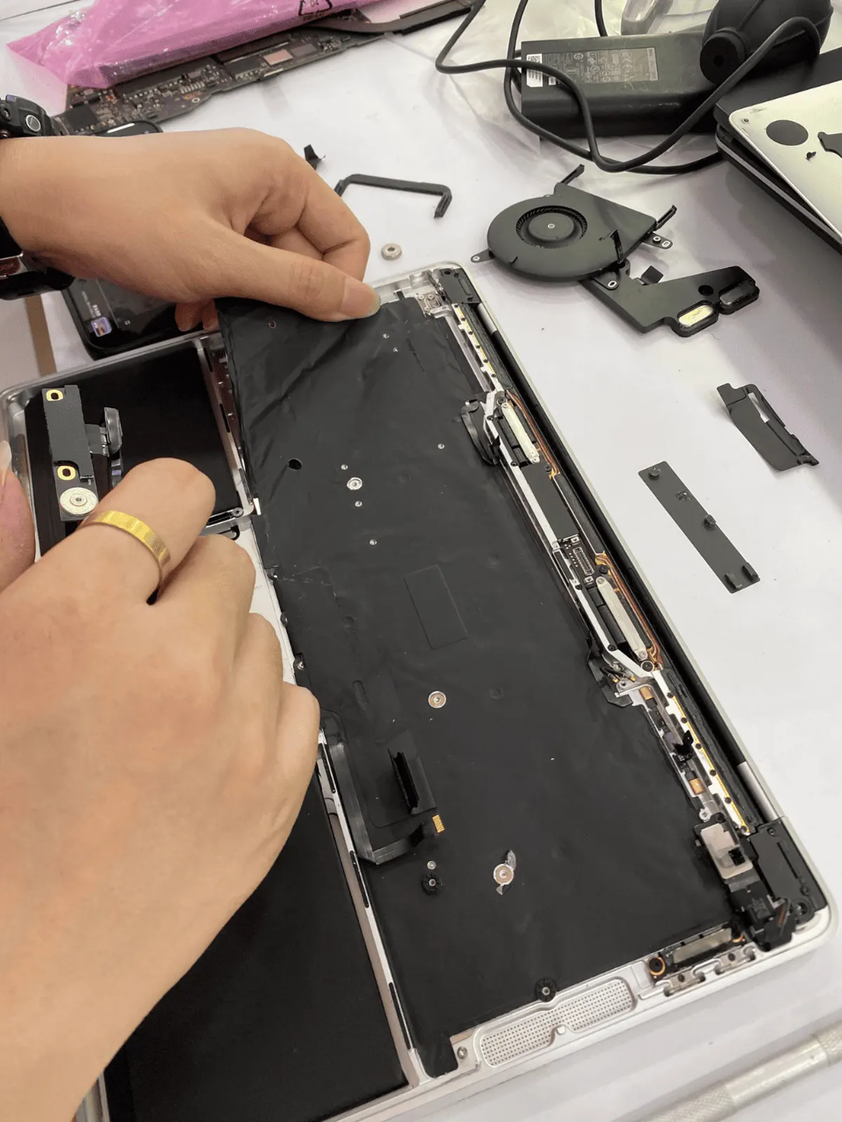Battery pack removed from a MacBook on the SPR workbench